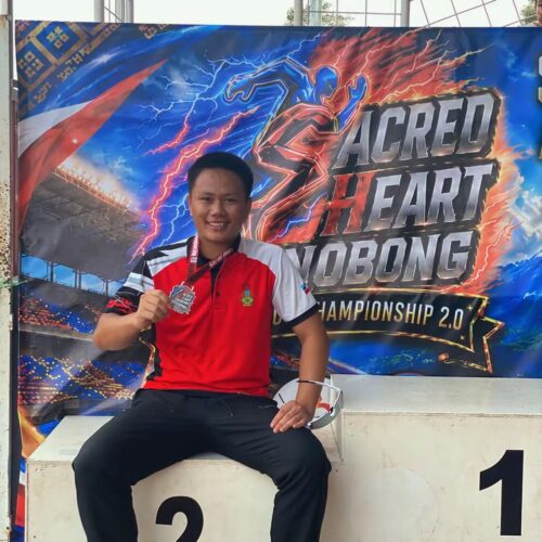 Cyberjaya College Kota Kinabalu student-athlete celebrating a medal-winning performance at the athletics championship
